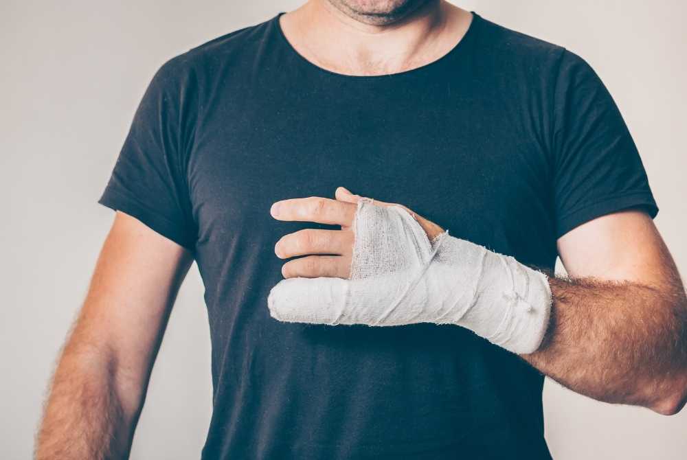 doctor treating arm fracture injury