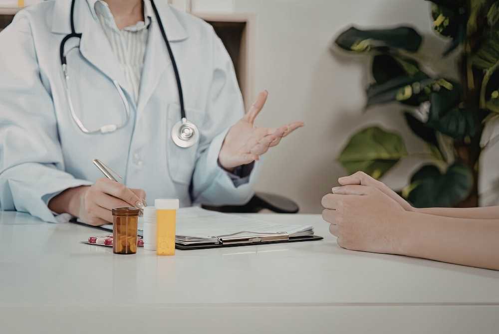 medical consultation reviewing injury x ray